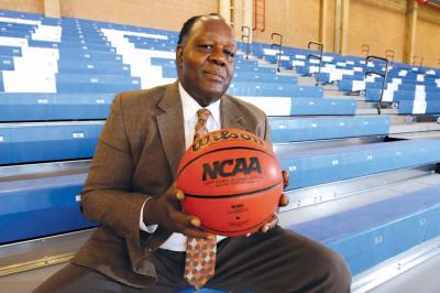 Charlie, Titus, left, coaching legend at UMass Boston, is leaving the bench. 